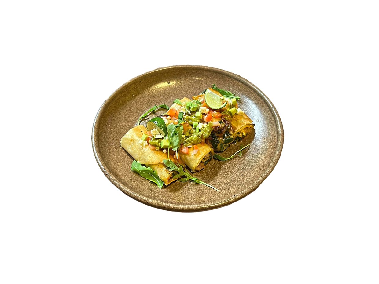 Queso Moringa features fresh moringa leaves between layers of melted cheese inside a fried tortilla.