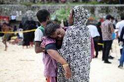 Rohingya refugees stranded on Indonesia beach to be moved after local rejection