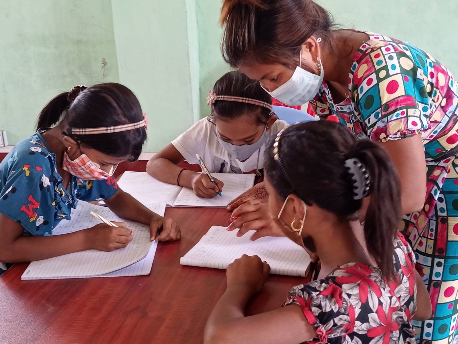 Adolescent Rohingya girls attending class in Rakhine State, Myanmar