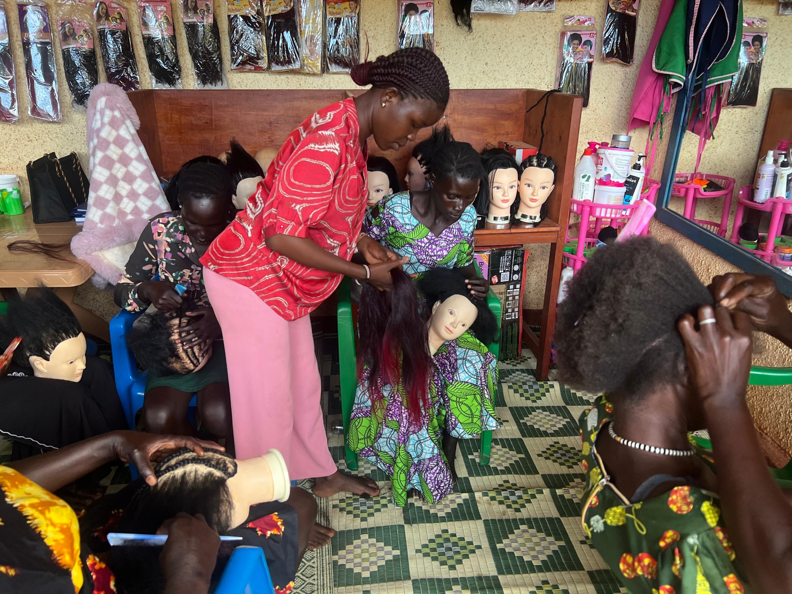 Winny teaching hairdressing skills
