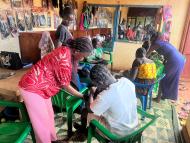 Winny Isaac teaching hairdressing skills