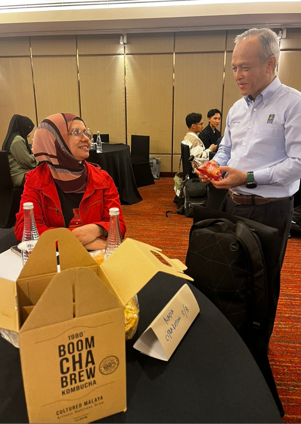 (Right) SIRIM QAS International Management System Certification Department Chemical & Material head Md Zaini Md Jai taking a closer look at kombucha tea samples.