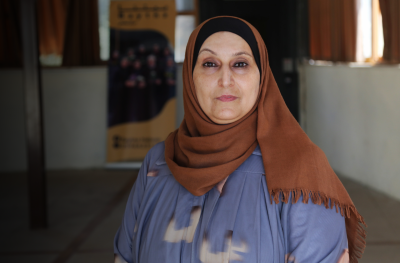 Palestine program participant in the West Bank loos directly at camera